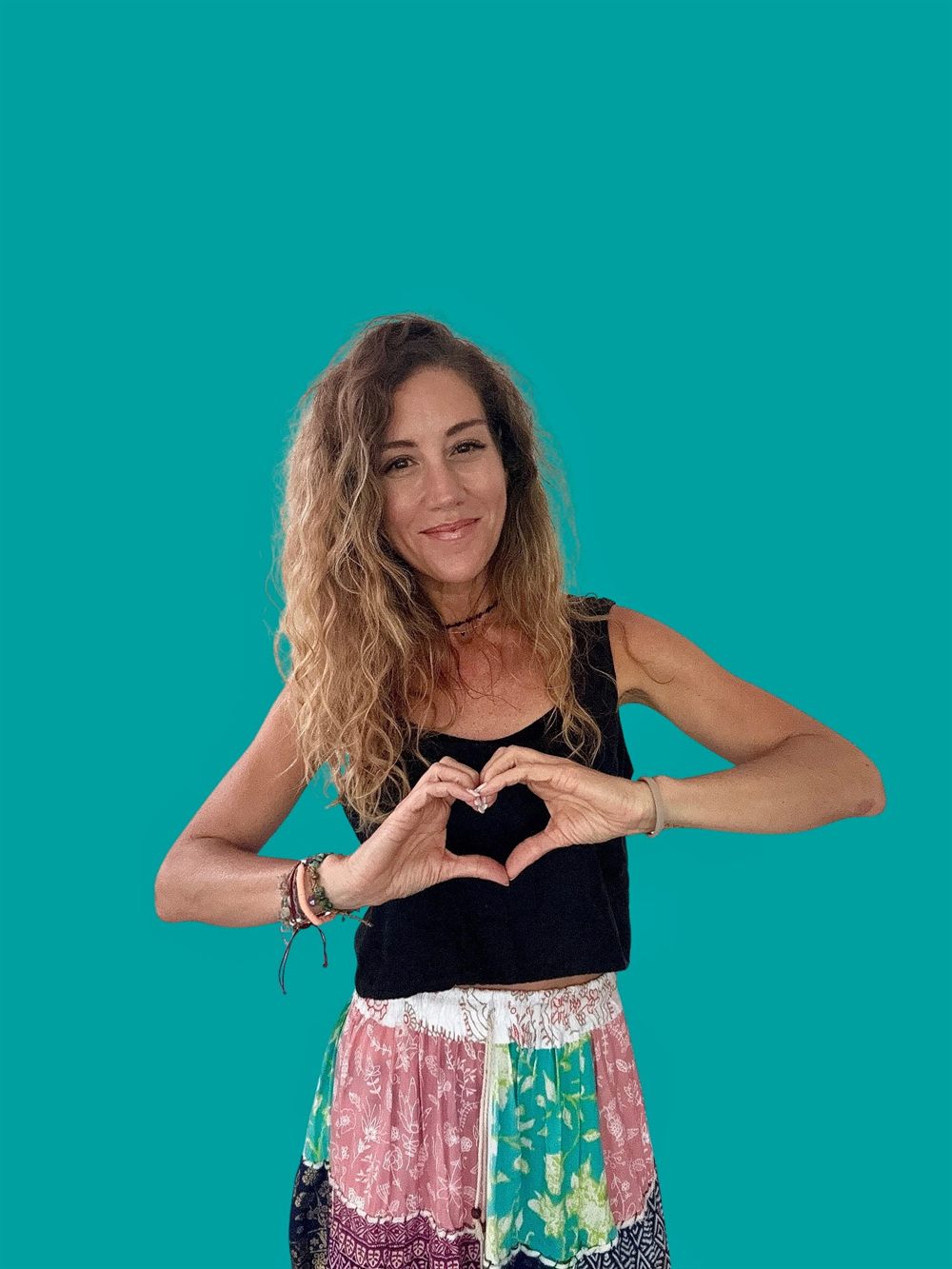 Lala making a heart with her hands.